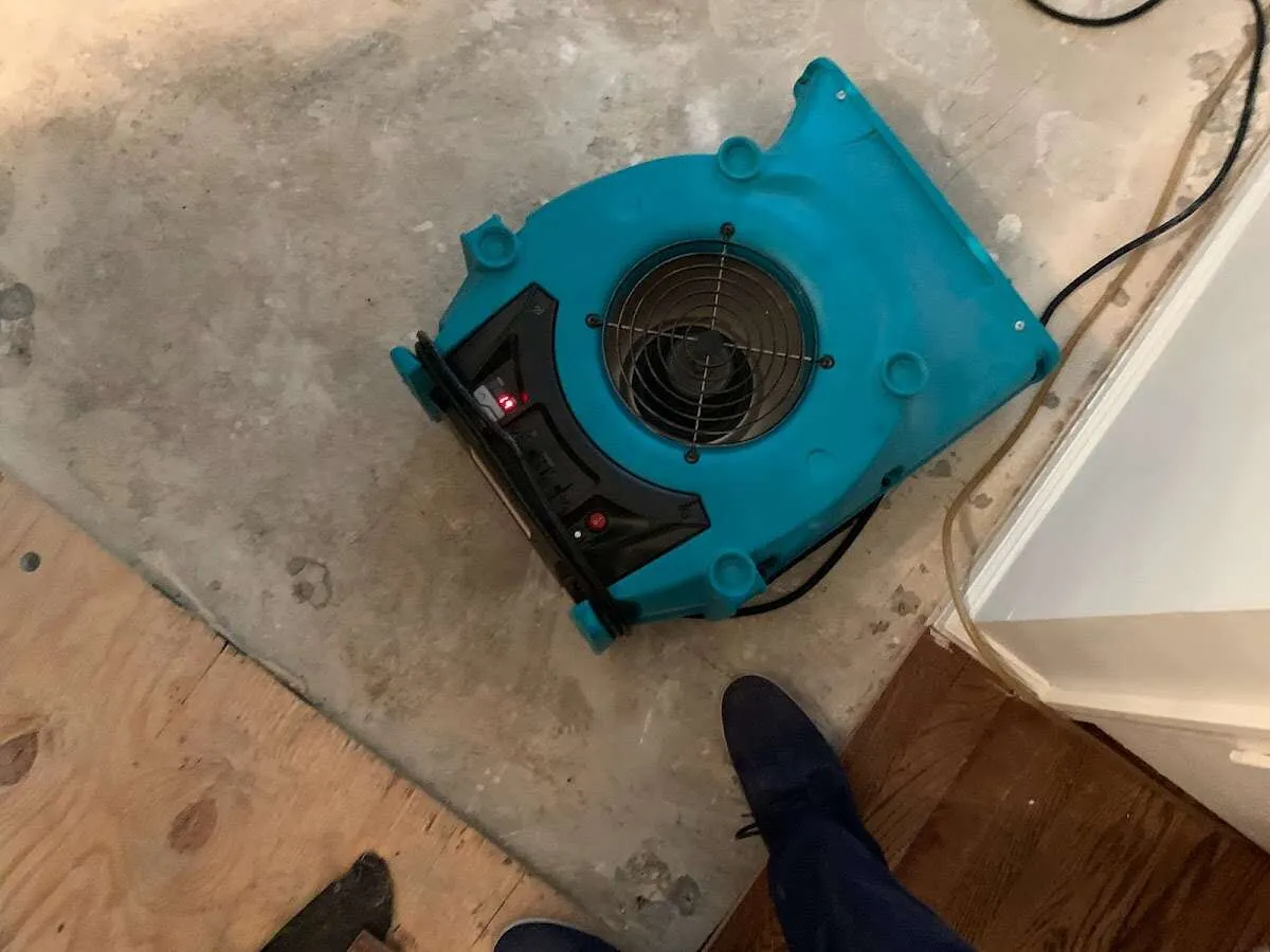 Air mover drying subfloor during Leak Detection & Repair in Ocala